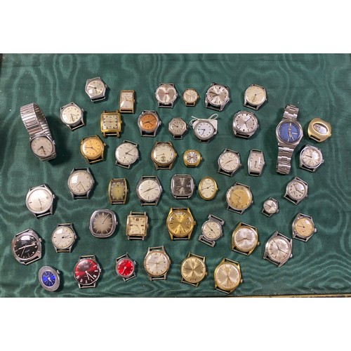 76 - A collection of watch heads and two wristwatches -