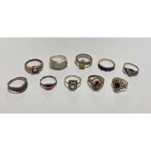 111 - A group of ten silver rings, some stone set -