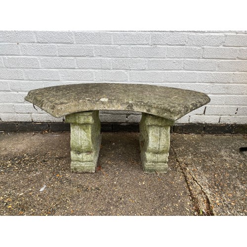 486 - A stone garden bench -