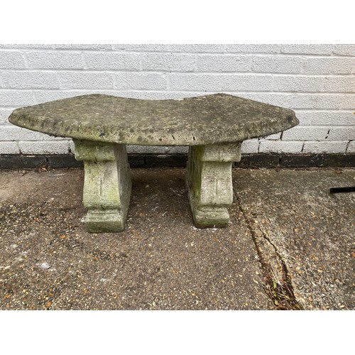 486 - A stone garden bench -