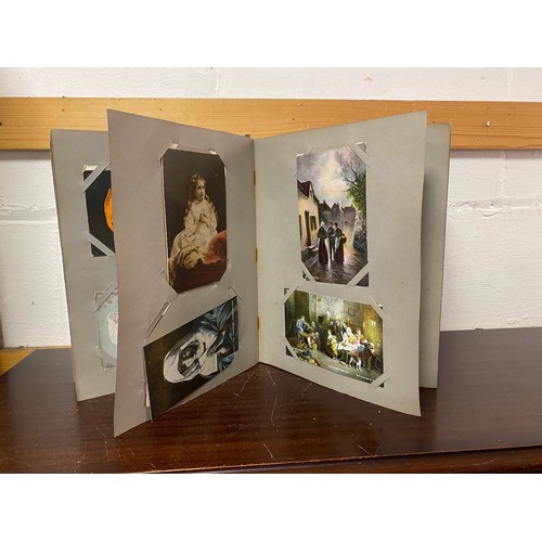 180 - Postcards: an album of approximately 190 vintage postcards including Bamforth song cards, greetings ... 