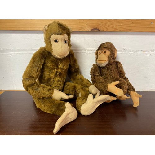 185 - Toys: a Farnells Alpha Toy plush monkey, labelled to paw, and another smaller monkey (2) -