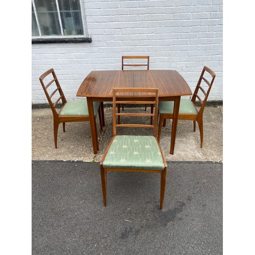 325 - A mid-century extending dining table, by Morris of Glasgow, with four ladderback chairs -