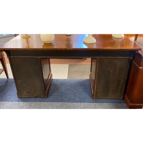 359 - A mahogany pedestal desk, the top with three frieze drawers over pedestals each with two drawers -