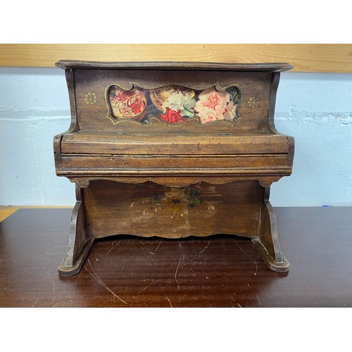 235 - A novelty German toy piano, the wooden case painted with flower decoration -