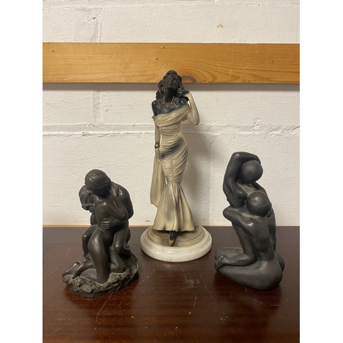 243 - A sculpture of a naked couple, another and a single lady (3) -