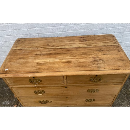 368 - A Victorian stripped pine chest, fitted with two short and three long drawers -