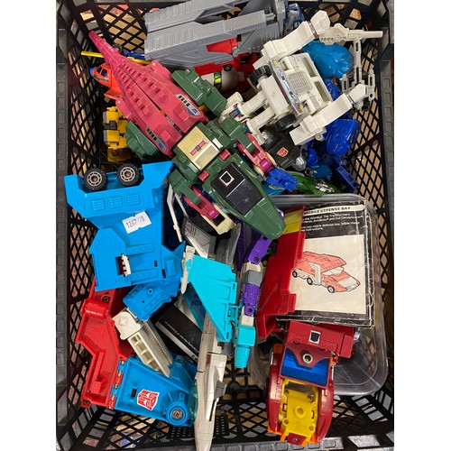 259 - Toys: a quantity of 1980's Transformers toys -