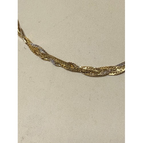 50 - A 9ct gold woven link necklace (twisted) -