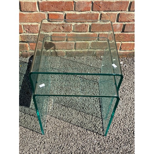 381 - A nest of two modern glass tables -