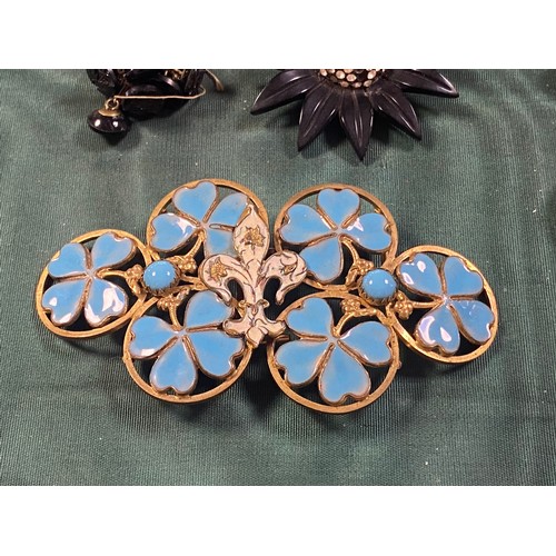 64 - An early 20th century enamelled buckle, together with miniature enamelled buttons, cut steel buttons... 