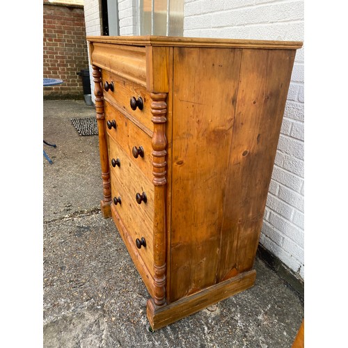 411 - A 19th century pine chest, fitted with ogee drawer over four graduated drawers, all between column s... 