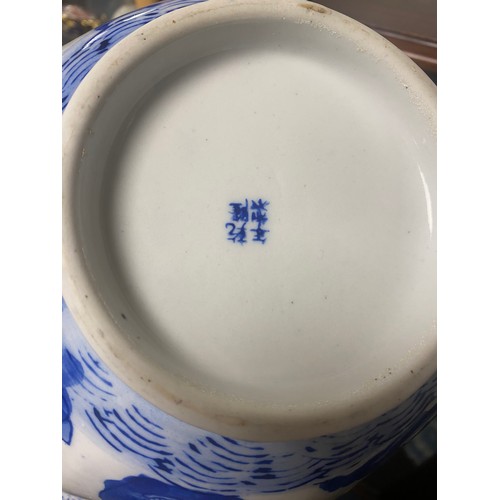 107A - A Chinese blue and white panelled bowl, decorated with figures to exterior and flowers to interior -