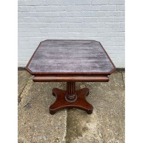 253 - A 19th century mahogany foldover tea table, the top with canted corners, on central support and quat... 