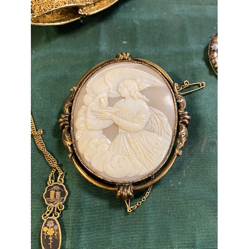 74 - A 19th century carved shell cameo depicting Hebe and the eagle, Japanese Shakudo jewellery etc