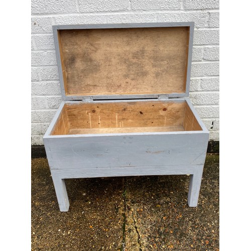 272 - A blue painted pine box on legs, with side carry handles -