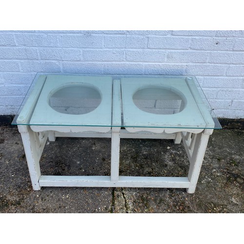 278 - A glass topped and painted coffee table -