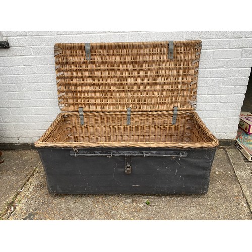 352 - A canvas mounted wicker trunk/basket -