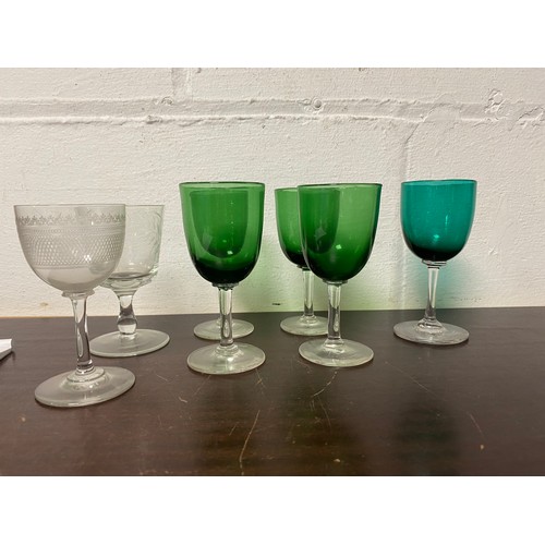 107 - An 18th century drawn stem wine glass, a pair of glasses and other glassware -