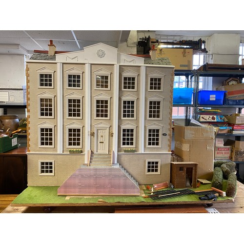 197 - An impressive modern dolls house, modelled as a large Georgian style house, with base and some furni... 