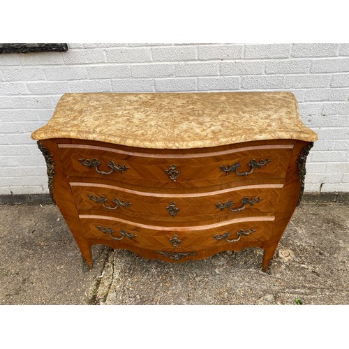 298 - A French style marble topped Kingwood commode, serpentine fronted and metal mounted, with three long... 