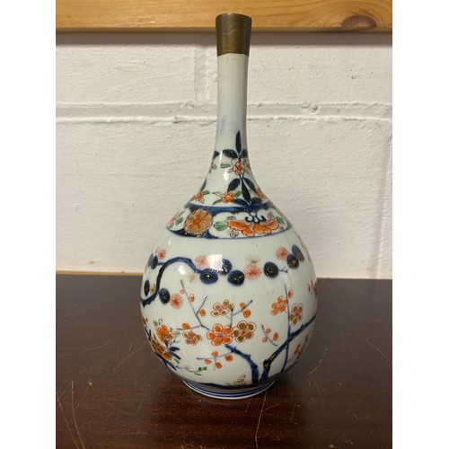 126 - A Chinese bottle vase, enamelled with flowering branches, in Imari palette -