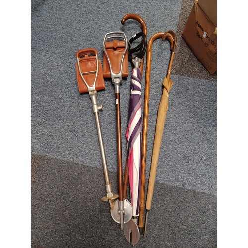 359 - A group of shooting sticks, and walking sticks -