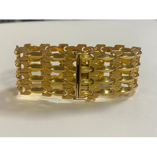 17 - An 18ct gold four bar bracelet, with panelled links and box clasp -