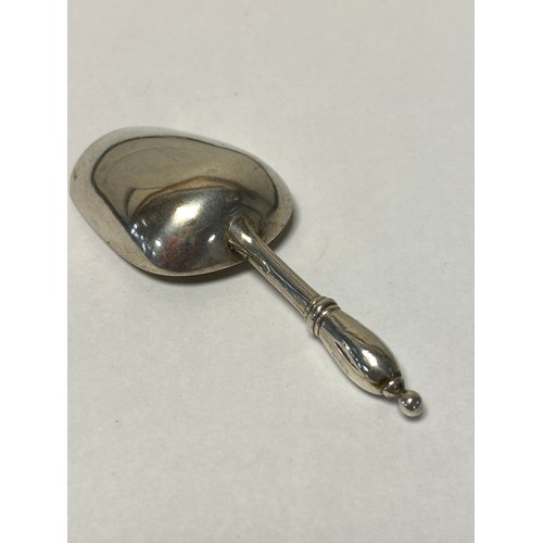 20 - A Russian silver caddy spoon, 84 Zolotnik marks -