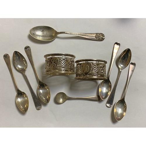 39 - A pair of silver napkin rings, Birmingham 1910, together with a set of six silver teaspoons, a silve... 