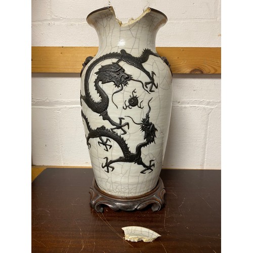 157 - A late 19th/early 20th century Chinese crackleware vase, moulded with mask and ring handles and a dr... 