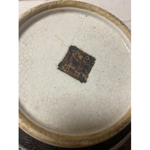 173 - A late 19th/early 20th century Chinese crackleware bowl, the interior decorated with a panel of flow... 