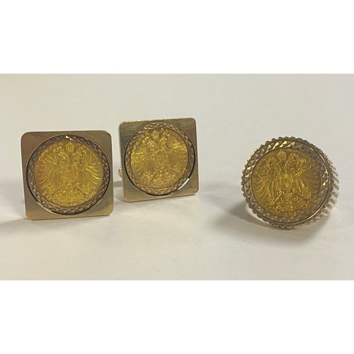 53 - A gold coin inset suite of jewellery, comprising a pair of 9ct cufflinks and a ring, each set with a... 