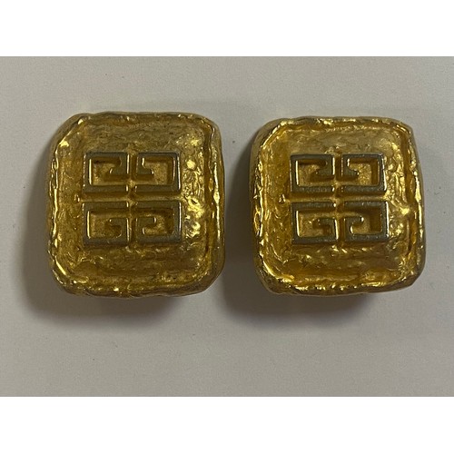 58 - A pair of vintage Givenchy gold tone ear clips -