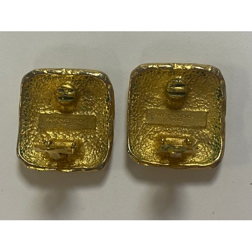 58 - A pair of vintage Givenchy gold tone ear clips -