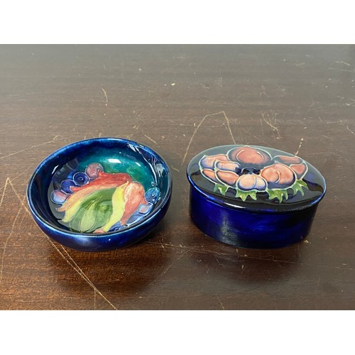 183 - A small Moorcroft bowl, together with an oval Moorcroft bowl and cover -