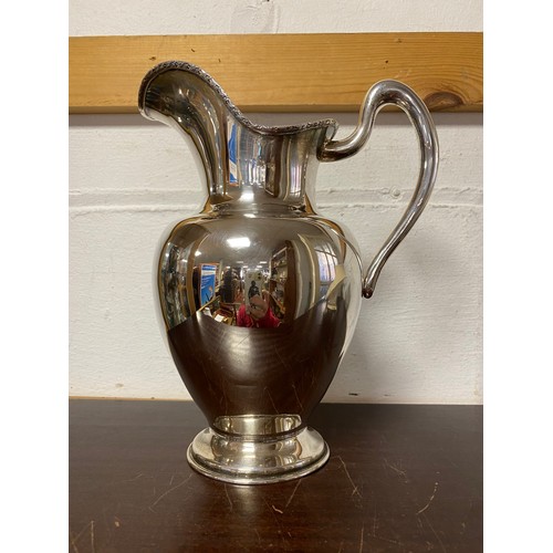 59 - A South American white metal pitcher jug, stamped 0.900 -