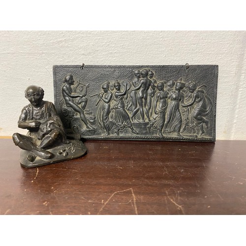 348 - A bronze of a seated tailor, together with a classical style panel -