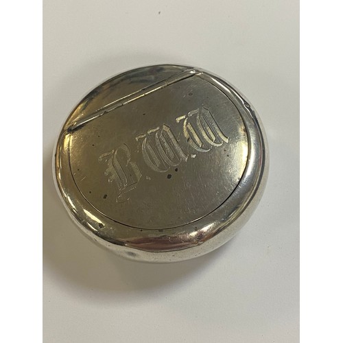 73 - A silver tobacco/snuff box, circular, initialled -