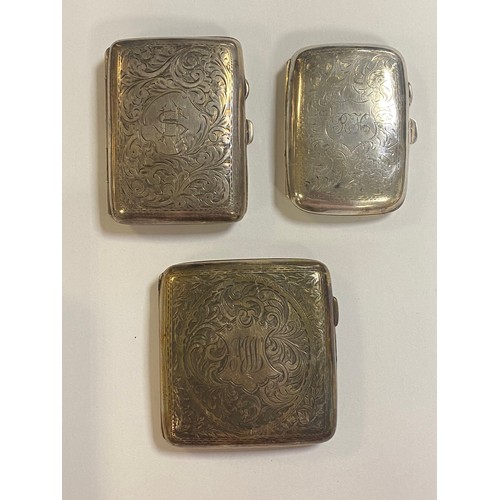 83 - A group of three antique silver cigarette cases, various dates and makers, each with engraved decora... 