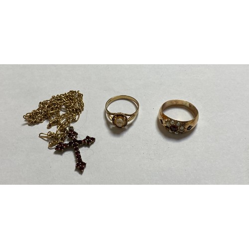 100 - A 9ct gold necklace suspending a Bohemian garnet set cross, a garnet and pearl ring (a/f) and a came... 