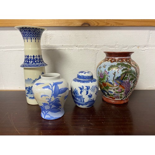 185 - A modern Chinese blue and white vase, a small Japanese vase, a ginger jar and cover and another vase... 