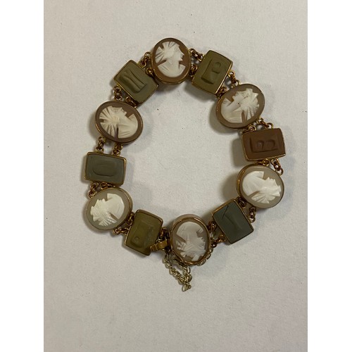 122 - A 19th century cameo bracelet, composed of alternate lava cameo letter panels and oval profile cameo... 