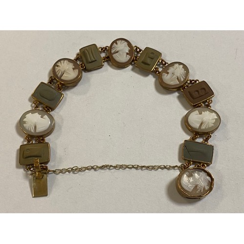 122 - A 19th century cameo bracelet, composed of alternate lava cameo letter panels and oval profile cameo... 