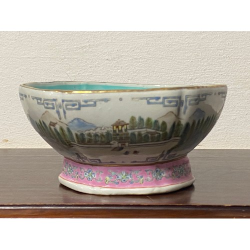 193 - A Chinese Qing style bowl, decorated with a continuous mountainside river scene, with pink foot rim,... 