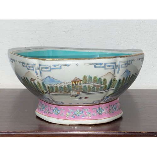 193 - A Chinese Qing style bowl, decorated with a continuous mountainside river scene, with pink foot rim,... 