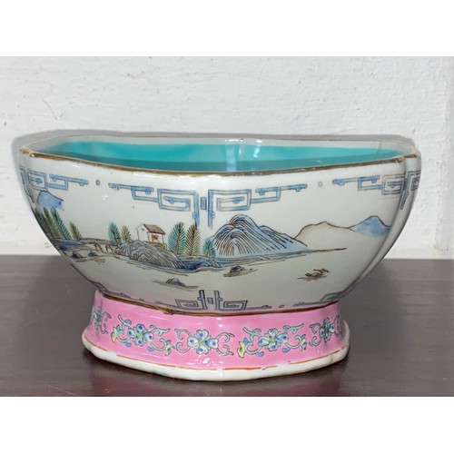 193 - A Chinese Qing style bowl, decorated with a continuous mountainside river scene, with pink foot rim,... 