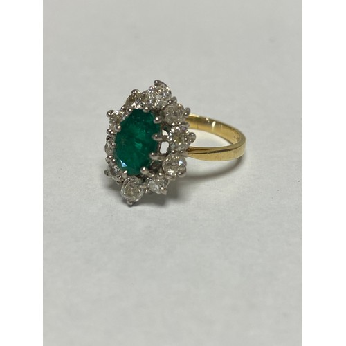 124 - An emerald and diamond dress ring, set with an oval emerald within a border of ten diamonds, to 18ct... 