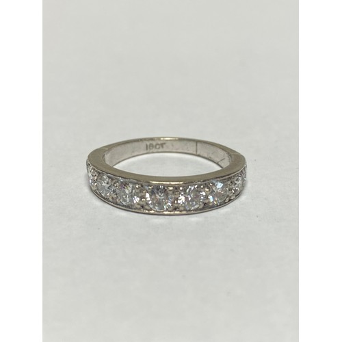 125 - A diamond half eternity band, set with nine graduated diamonds in 18ct white gold -