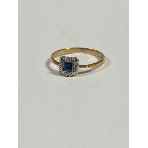 129 - An Edwardian 9ct gold ring, set with a square sapphire and diamond points -